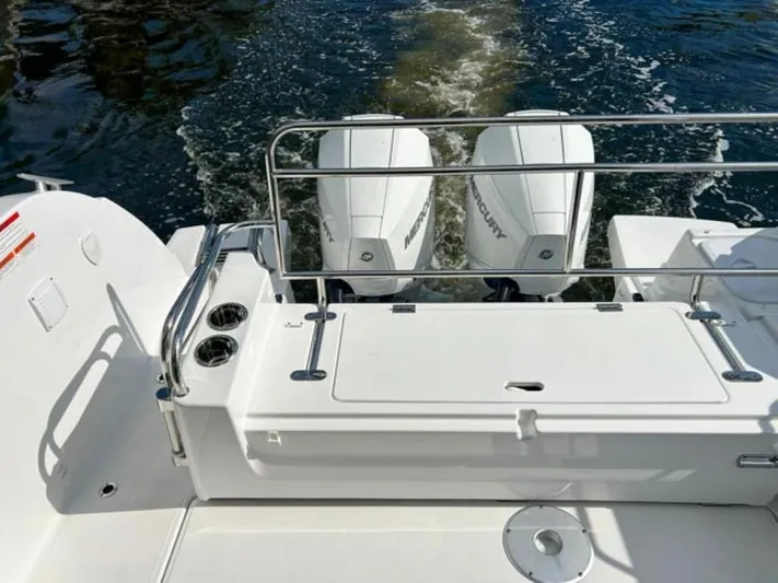  Yacht Photos Pics 2025 Beneteau Antares 9 boat with dual Mercury outboard engines on water.