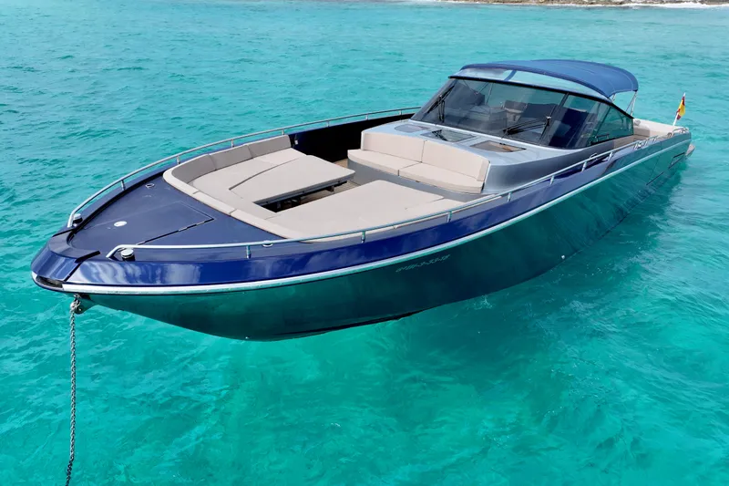 Double K Yacht Photos Pics Luxurious 2010 CNM CONTINENTAL TENDER 50 yacht on clear turquoise water.