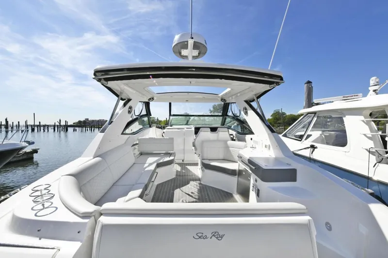  Yacht Photos Pics 2022 Sea Ray Sundancer 320 yacht interior with luxurious seating and open deck.