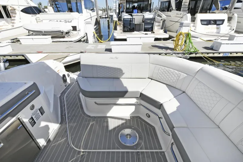  Yacht Photos Pics 2022 Sea Ray Sundancer 320 yacht interior with elegant seating at marina.