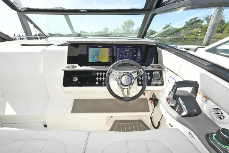  Yacht Photos Pics 2022 Sea Ray Sundancer 320 helm with modern navigation and control systems.