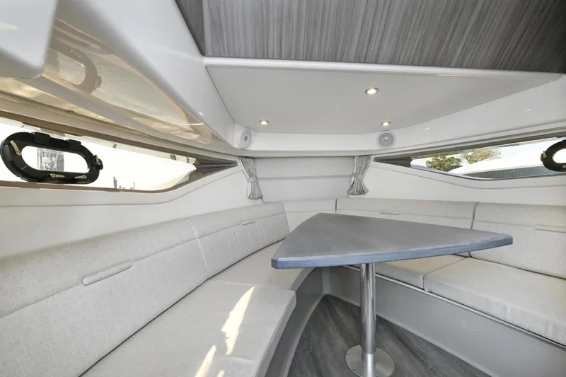  Yacht Photos Pics Interior of 2022 Sea Ray Sundancer 320 yacht with modern seating and table.