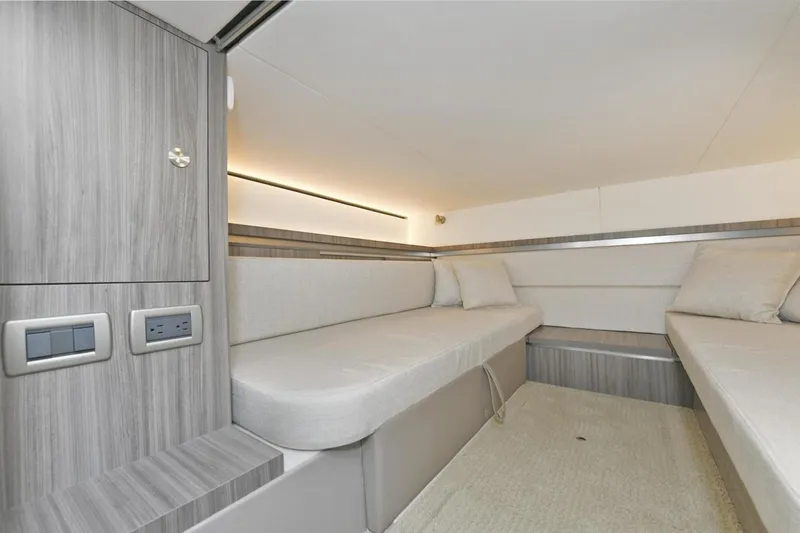  Yacht Photos Pics 2022 Sea Ray Sundancer 320 cabin interior with modern seating and wood paneling.