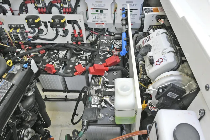  Yacht Photos Pics Engine room of 2022 Sea Ray Sundancer 320, showcasing batteries and electrical components.