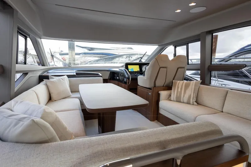  Yacht Photos Pics Luxurious interior of 2025 Princess F50 yacht with elegant seating and modern helm.