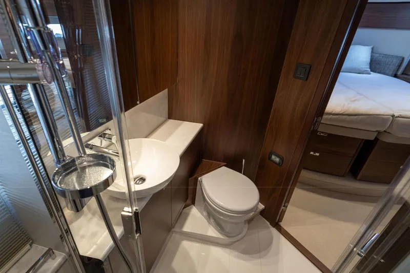 Yacht Photos Pics Luxurious bathroom in 2025 Princess F50 yacht with modern fixtures and wood accents.