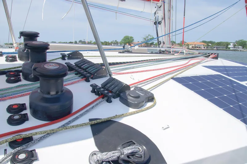 Out Of The Woods Yacht Photos Pics Deck of a 2022 NEEL 51 trimaran with ropes and winches.