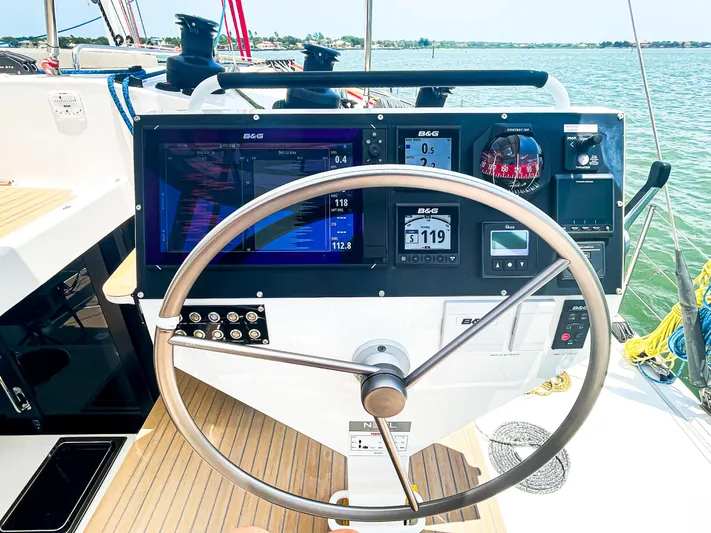 Out Of The Woods Yacht Photos Pics Helm of NEEL 51 yacht, 2022 model, featuring modern navigation instruments.