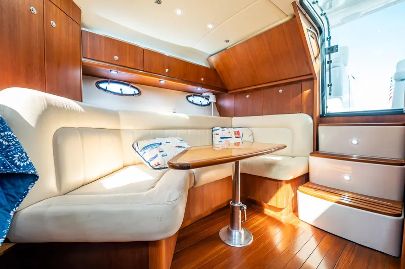 Maggie Yacht Photos Pics Luxurious 2005 Tiara Yachts 3200 Open interior with elegant wood finish and plush seating.