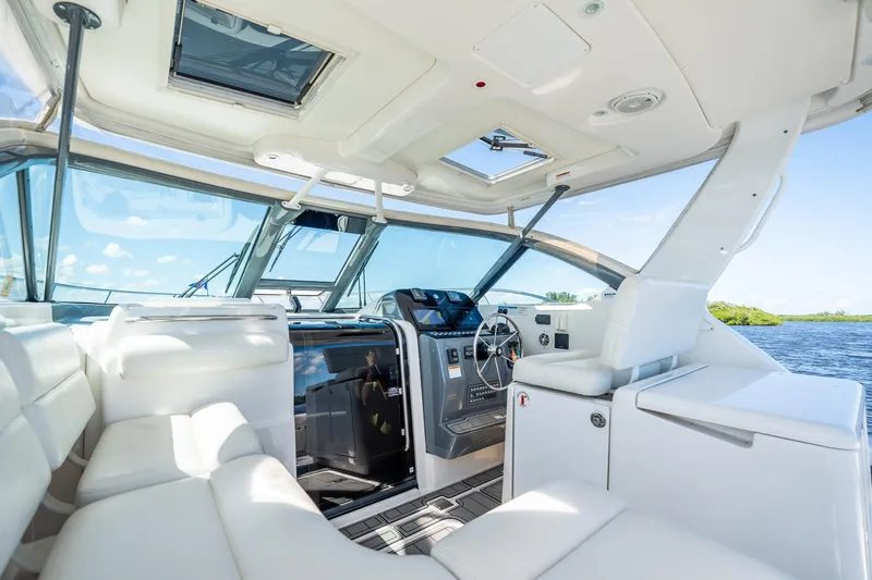 Maggie Yacht Photos Pics Interior of 2005 Tiara Yachts 3200 Open, featuring luxurious seating and modern helm.