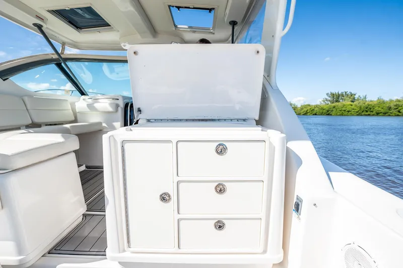 Maggie Yacht Photos Pics 2005 Tiara Yachts 3200 Open interior with storage drawers, open water view.