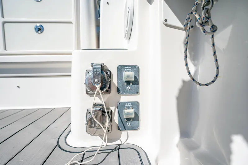 Maggie Yacht Photos Pics 2005 Tiara Yachts 3200 Open shore power connections on deck with rope detail.