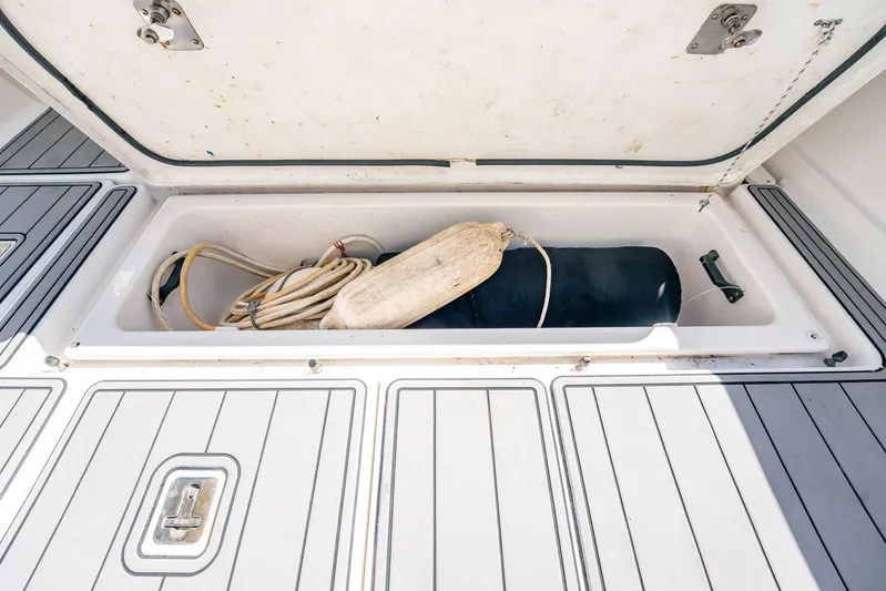 Maggie Yacht Photos Pics Open storage compartment on 2005 Tiara Yachts 3200 Open, containing rope and fender.