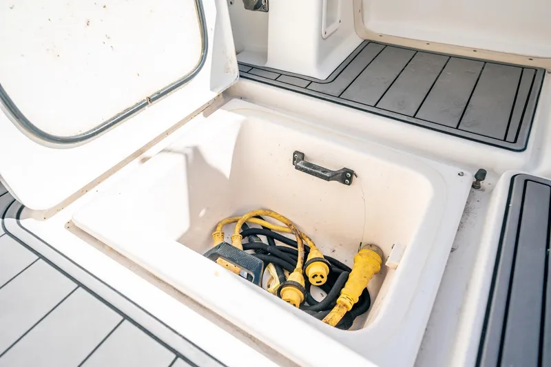Maggie Yacht Photos Pics Storage compartment on 2005 Tiara Yachts 3200 Open with yellow power cables.