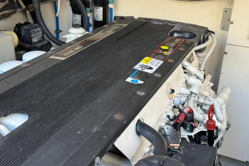 Maggie Yacht Photos Pics Engine compartment of a 2005 Tiara Yachts 3200 Open, showcasing detailed components and wiring.