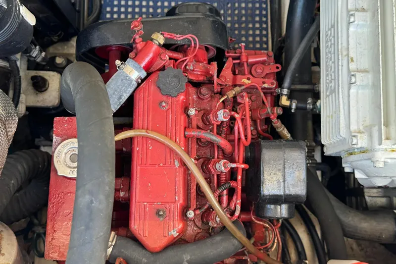 Maggie Yacht Photos Pics Engine compartment of a 2005 Tiara Yachts 3200 Open, featuring a red engine block.