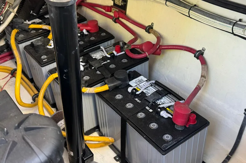 Maggie Yacht Photos Pics Battery compartment of a 2005 Tiara Yachts 3200 Open with connected cables.