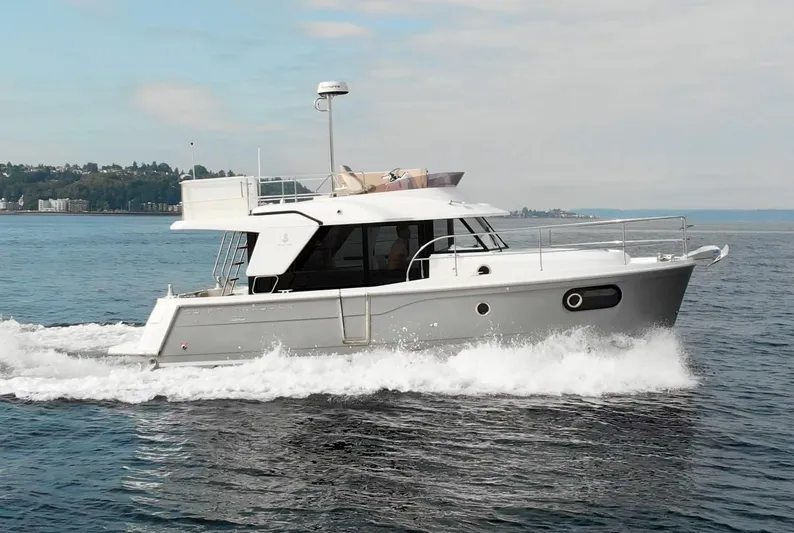 Everything Is Fine Yacht Photos Pics 2019 Beneteau Swift Trawler 30 cruising on open water.