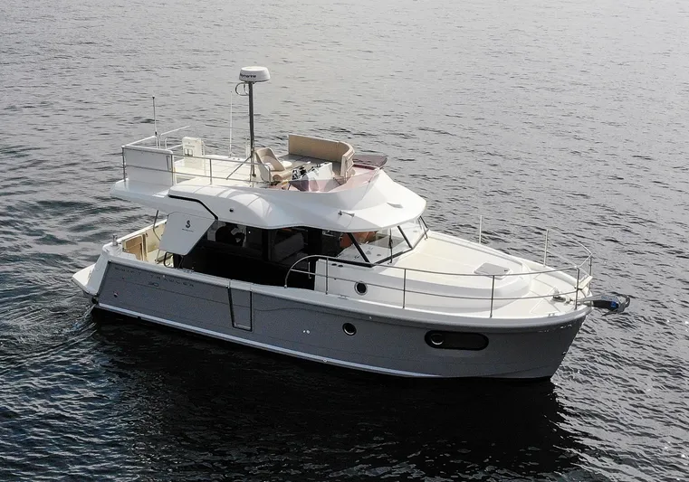 Everything Is Fine Yacht Photos Pics 2019 Beneteau Swift Trawler 30 cruising on calm waters.