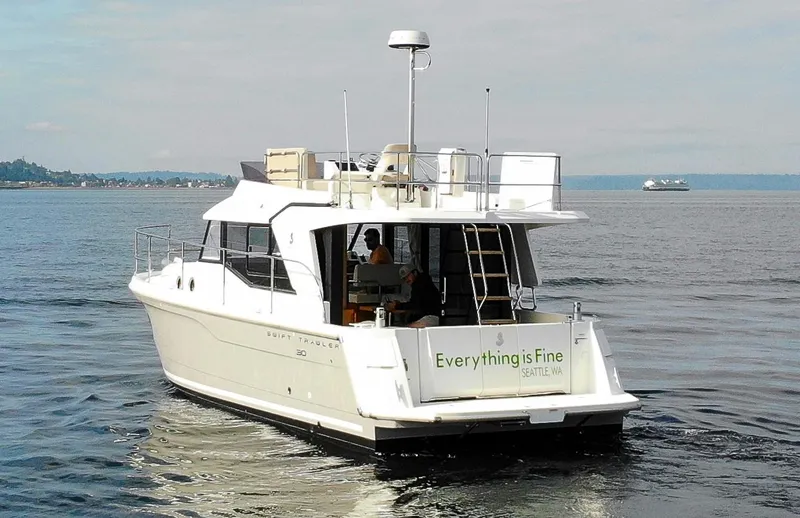 Everything Is Fine Yacht Photos Pics 2019 Beneteau Swift Trawler 30 cruising on calm waters near Seattle.