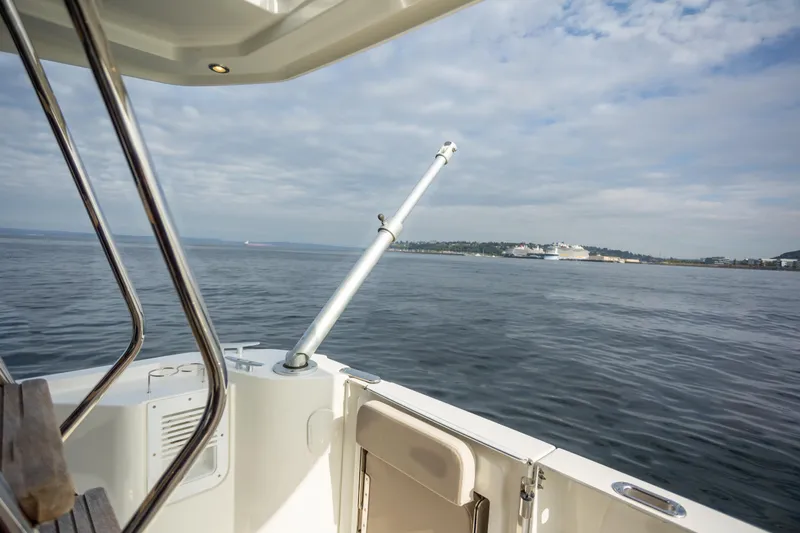 Everything Is Fine Yacht Photos Pics 2019 Beneteau Swift Trawler 30, ocean view from deck, calm waters, distant shoreline.