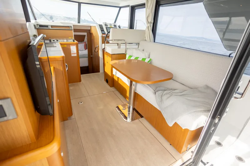 Everything Is Fine Yacht Photos Pics Interior of 2019 Beneteau Swift Trawler 30, featuring cozy seating and modern amenities.