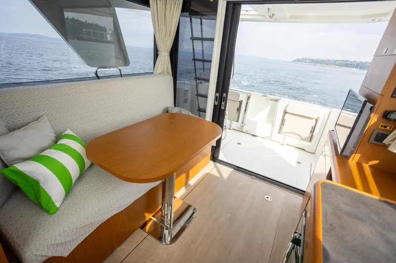 Everything Is Fine Yacht Photos Pics Interior of 2019 Beneteau Swift Trawler 30 with ocean view and cozy seating area.