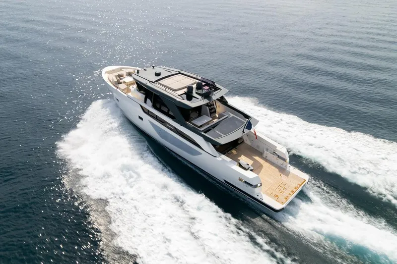  Yacht Photos Pics 2025 Bluegame BGX 63 yacht cruising on open water, showcasing sleek design and luxury.