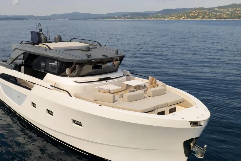  Yacht Photos Pics 2025 Bluegame BGX 63 yacht cruising on calm waters, showcasing sleek design and luxury features.