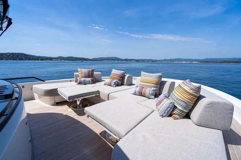  Yacht Photos Pics Luxurious 2025 Bluegame BGX 63 yacht deck with stylish seating and scenic ocean view.