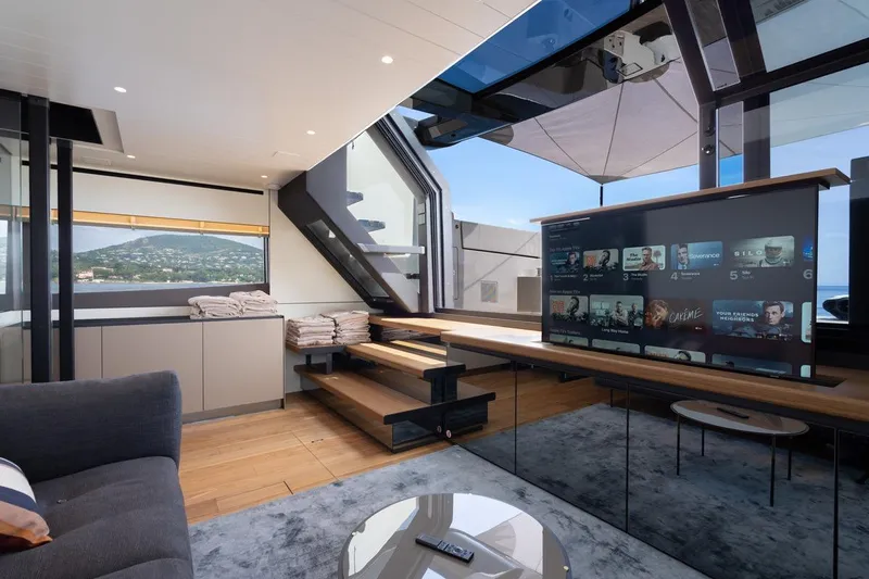  Yacht Photos Pics Luxurious interior of 2025 Bluegame BGX 63 yacht with modern entertainment system.