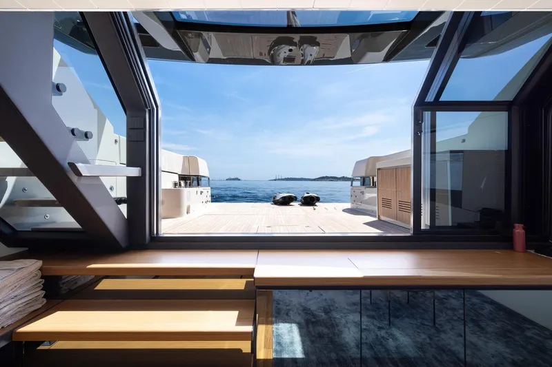  Yacht Photos Pics Interior view of 2025 Bluegame BGX 63 yacht, showcasing open deck and ocean scenery.