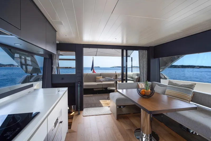  Yacht Photos Pics Luxurious interior of 2025 Bluegame BGX 63 yacht with ocean view and modern furnishings.