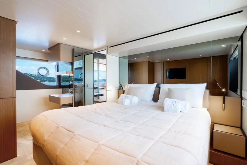  Yacht Photos Pics Luxurious interior of 2025 Bluegame BGX 63 yacht, featuring a spacious bedroom with modern design.