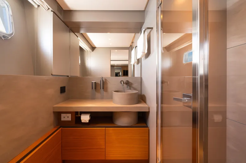  Yacht Photos Pics Luxurious bathroom interior of 2025 Bluegame BGX 63 yacht, featuring modern fixtures and elegant design.