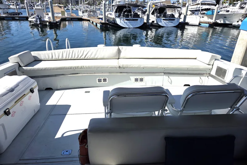 Halcyon Yacht Photos Pics 1984 Magnum Marine 53 yacht interior with seating area at marina.