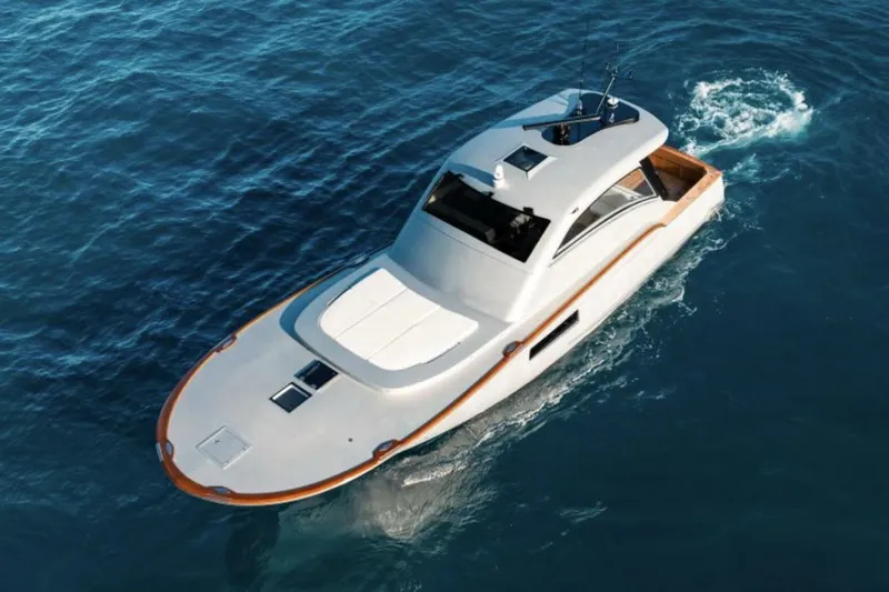  Yacht Photos Pics 2027 Buddy Davis 52 Euro Coupe yacht cruising on open blue waters.