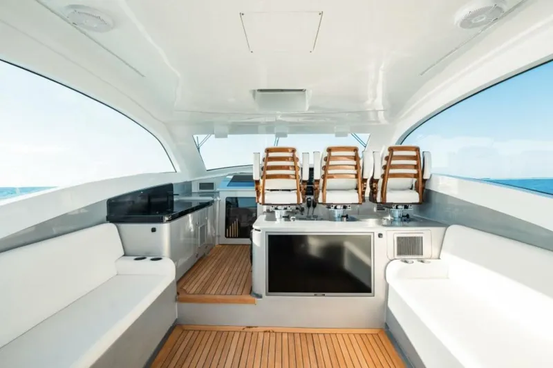  Yacht Photos Pics Luxurious interior of 2027 Buddy Davis 52 Euro Coupe yacht with elegant seating and modern amenities.