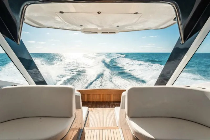  Yacht Photos Pics Luxury 2027 Buddy Davis 52 Euro Coupe yacht cruising on open sea.