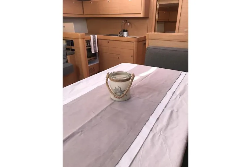  Yacht Photos Pics Interior of 2019 Dufour 460 Grand Large yacht with elegant dining area.