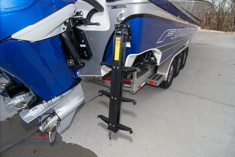  Yacht Photos Pics 2022 Fountain 38 SC boat with blue exterior and triple-axle trailer.