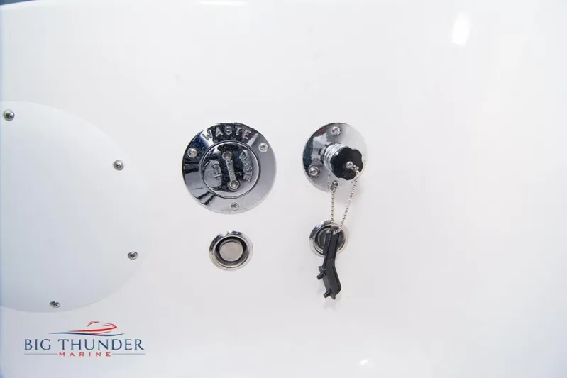  Yacht Photos Pics Close-up of 2022 Fountain 38 SC waste port with key and Big Thunder Marine logo.