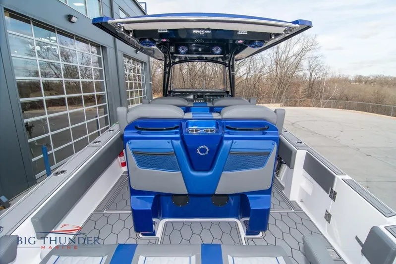  Yacht Photos Pics 2022 Fountain 38 SC boat interior with blue seating and modern design.