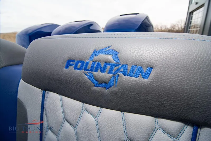  Yacht Photos Pics 2022 Fountain 38 SC boat seat with logo, featuring blue and gray upholstery.