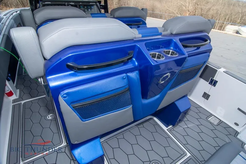 Yacht Photos Pics 2022 Fountain 38 SC boat interior with blue and gray seating and cup holders.
