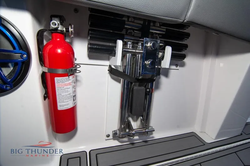  Yacht Photos Pics 2022 Fountain 38 SC boat interior with fire extinguisher and equipment storage.