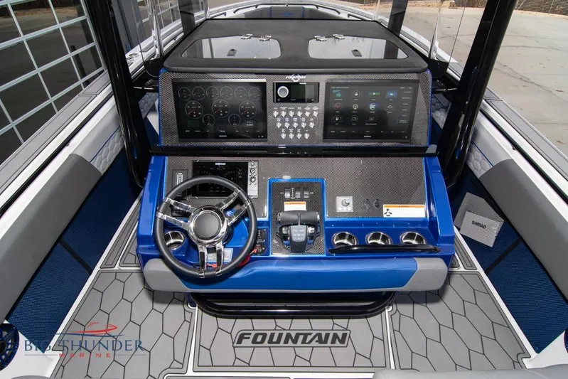  Yacht Photos Pics 2022 Fountain 38 SC boat dashboard with advanced controls and navigation system.