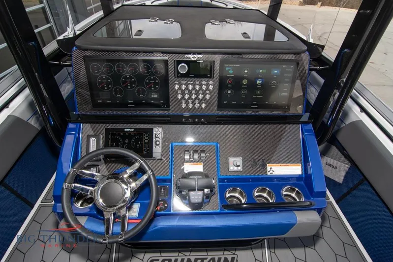  Yacht Photos Pics 2022 Fountain 38 SC boat dashboard with advanced controls and digital displays.