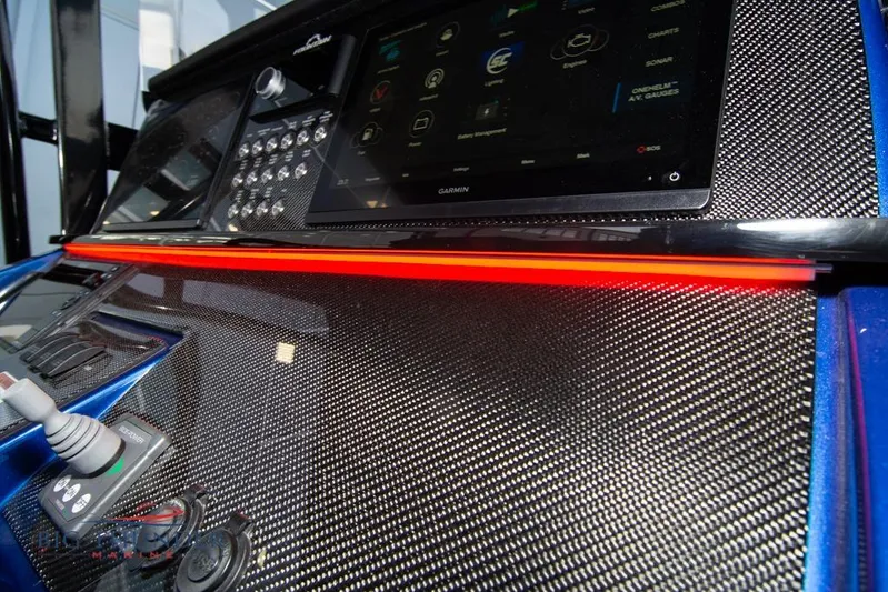  Yacht Photos Pics 2022 Fountain 38 SC dashboard with carbon fiber finish and advanced controls.