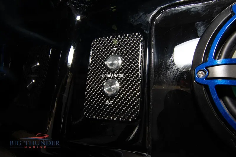  Yacht Photos Pics 2022 Fountain 38 SC boat control panel with SureShade buttons and speaker.